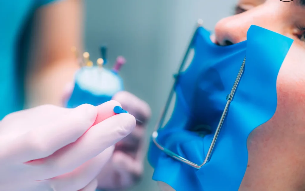 Patient receiving root canal treatment with a dental dam at Dorri's Dental in Boynton Beach, FL