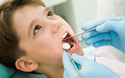 Child receiving a professional dental cleaning at Dorri's Dental in Boynton Beach, FL