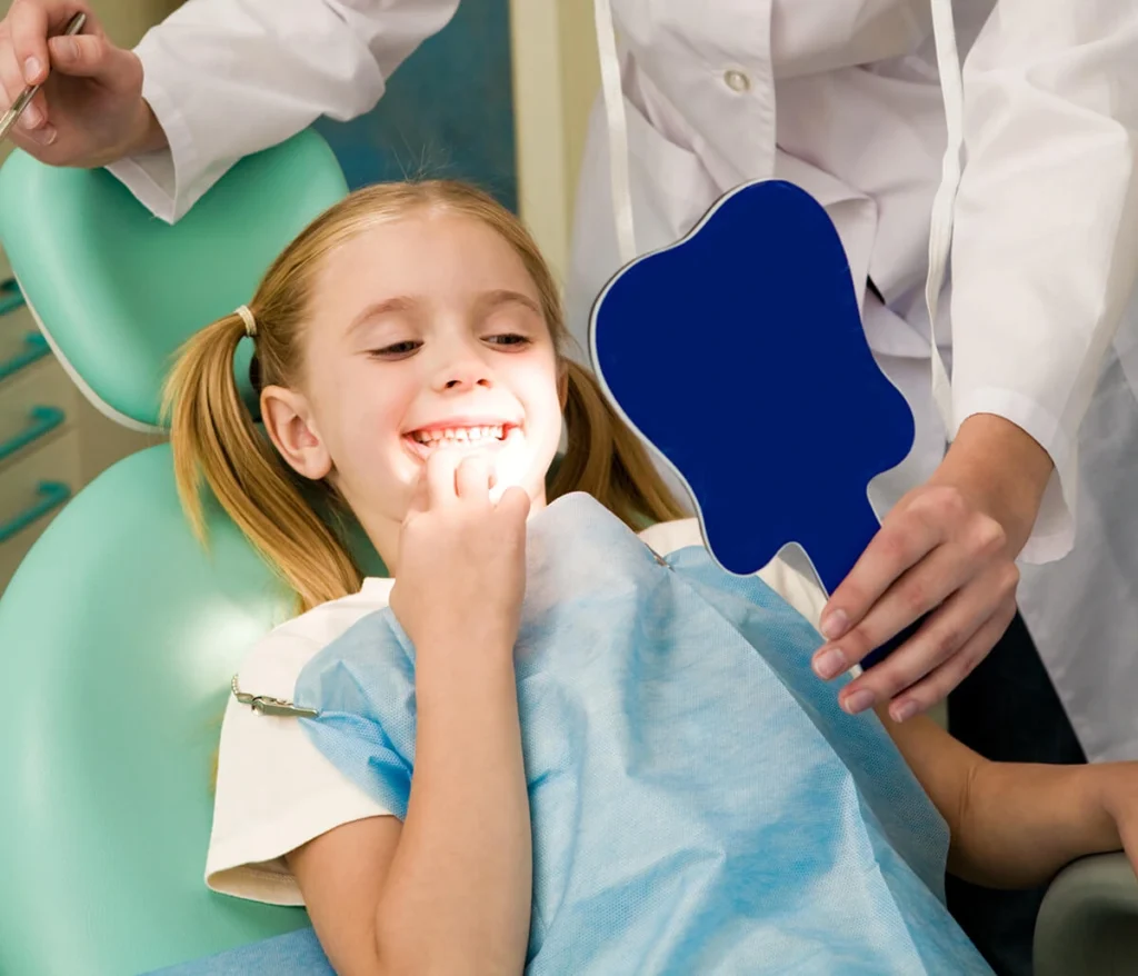Young girl smiling after a professional dental cleaning at Dorri's Dental in Boynton Beach, FL