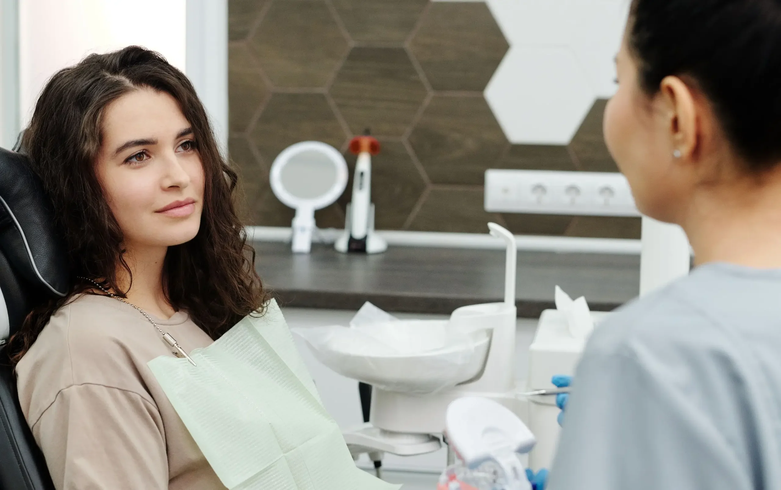 Patient in a dental chair during a consultation with a dentist in Boynton Beach, FL