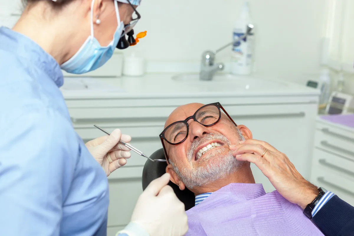 Dental exam showing dentist checking patient's teeth