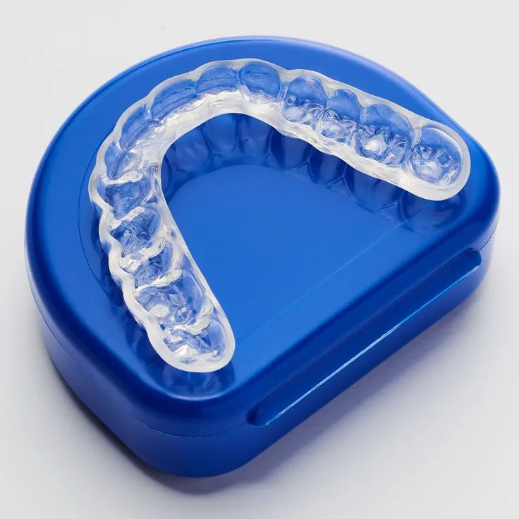 Custom night guard resting on its blue storage case at Dorri's Dental in Boynton Beach, FL