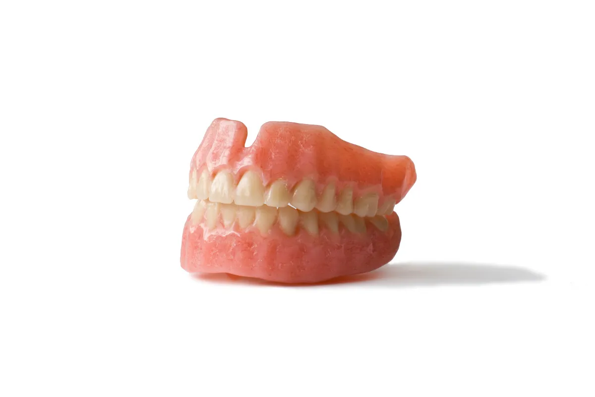 Dentist examining a patient with partial dentures