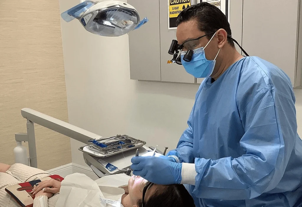 Dentist performing a detailed dental procedure on a patient in Boynton Beach